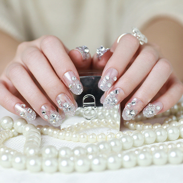 Sparkling artificial nails with rhinestones and sparkling accents Kalsten