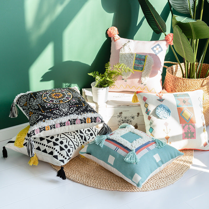 Square cushion cover with 3D alpaca appliqué, bouclé patch and pom-pom corners Kalsten