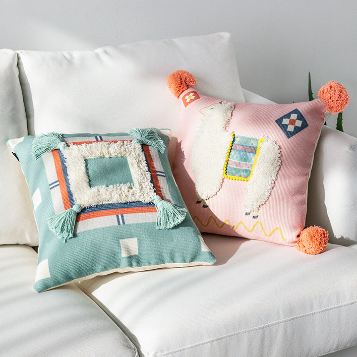 Square cushion cover with 3D alpaca appliqué, bouclé patch and pom-pom corners Kalsten