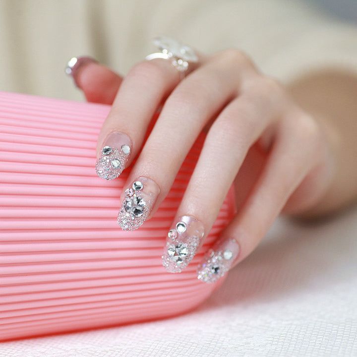 Sparkling artificial nails with rhinestones and sparkling accents Kalsten