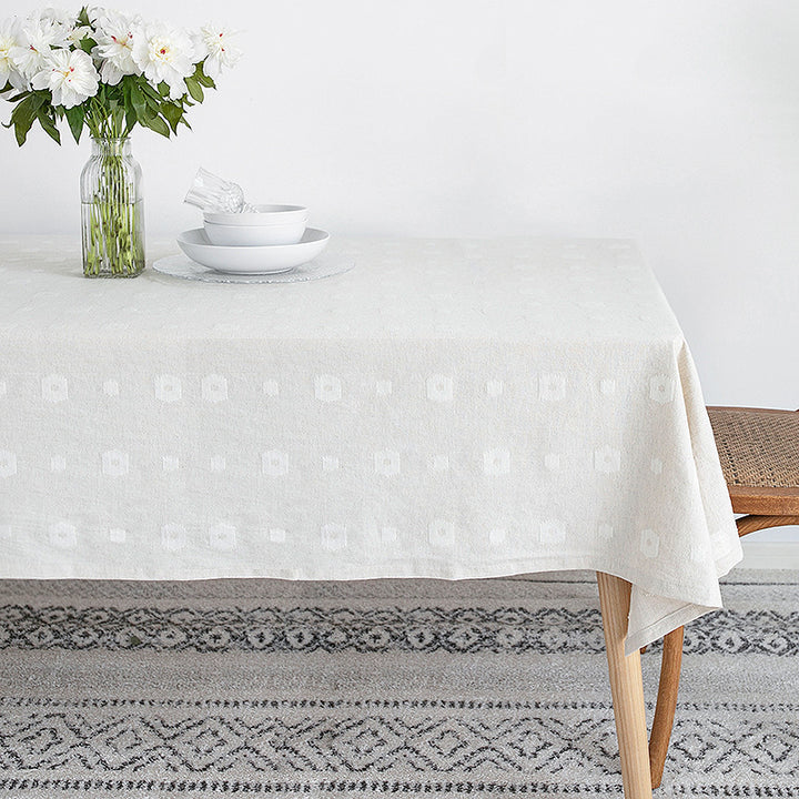 Tablecloth made of cotton blend with embossed square and circle relief Kalsten