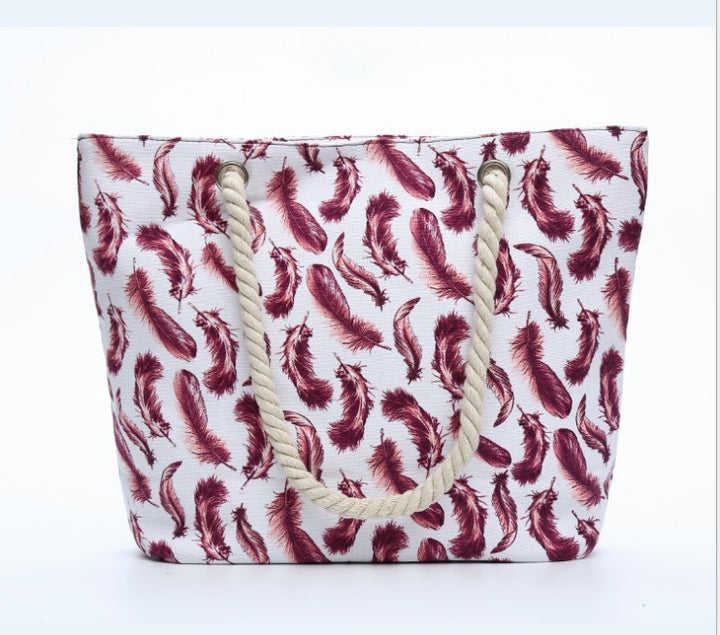 Beach bag with playful feather pattern Kalsten