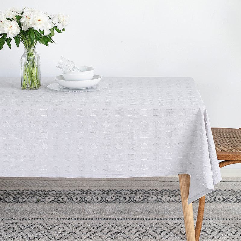Tablecloth made of cotton blend with embossed square and circle relief Kalsten