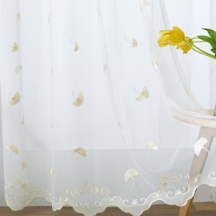Transparent curtain drape made of fine tulle with embroidered ginkgo leaves and curved lace finish Kalsten