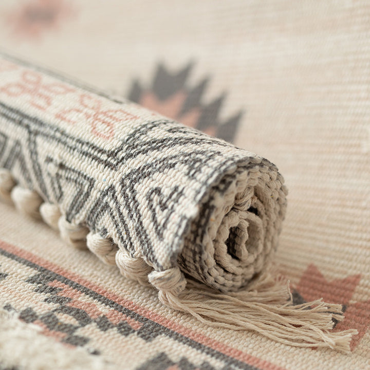 Flat woven runner in ethnic medallion style made of cotton-linen blend with hand-knotted fringes