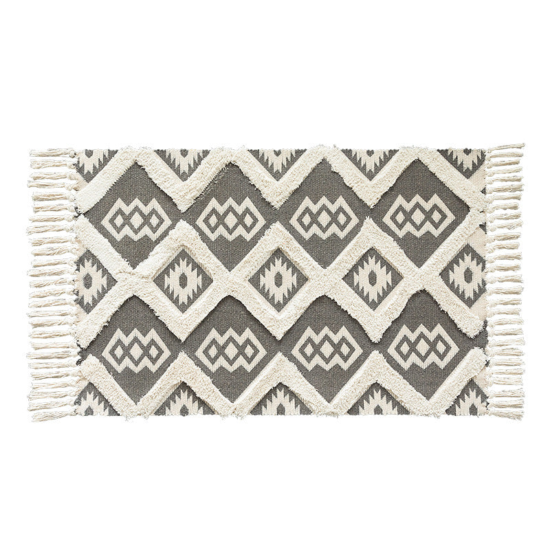 Flat woven runner in ethnic medallion style made of cotton-linen blend with hand-knotted fringes