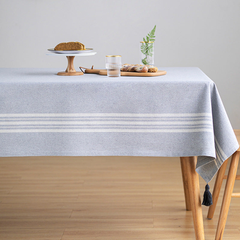Rectangular linen look tablecloth with fringed tassels and side stripe border design Kalsten