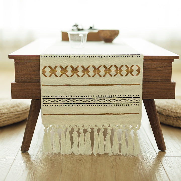 Woven Boho table runner made of cotton blend with decorative fringes and graphic stripe pattern Kalsten