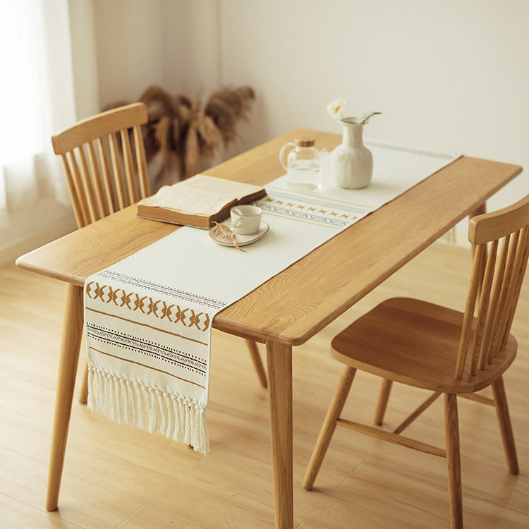 Woven Boho table runner made of cotton blend with decorative fringes and graphic stripe pattern Kalsten