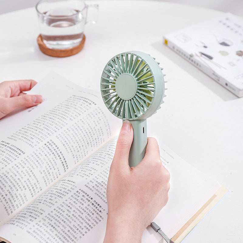 Unisex nan compact portable hand fan with rechargeable battery and USB charging port quiet operation self-standing Kalsten