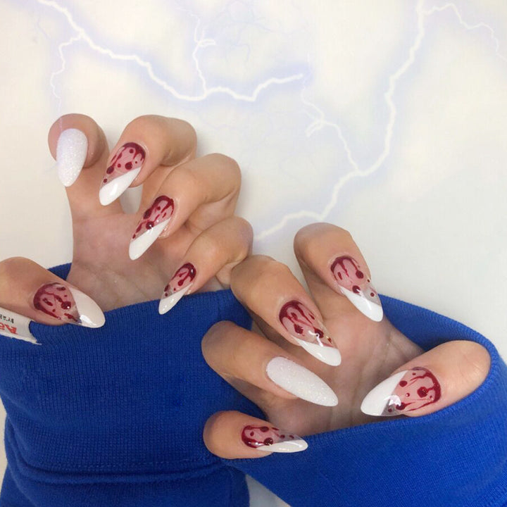Artistic acrylic nails with elegant flower and glitter accents Kalsten