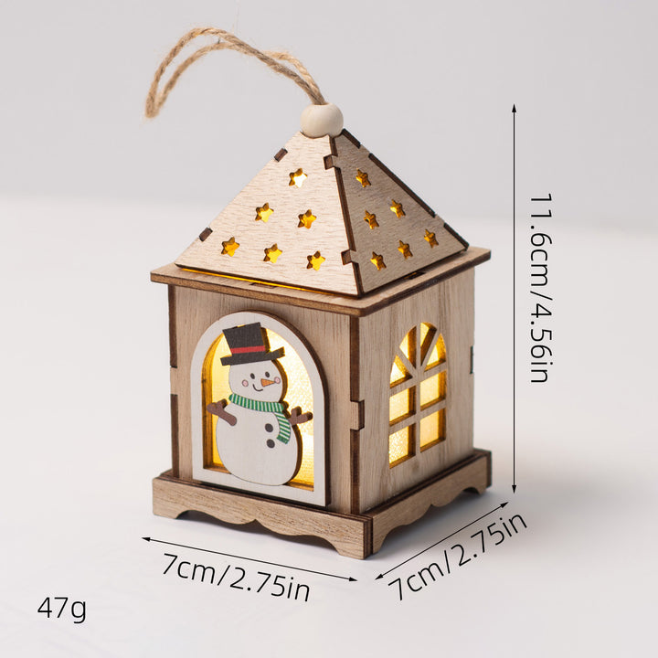 Illuminated wooden house as Christmas decoration