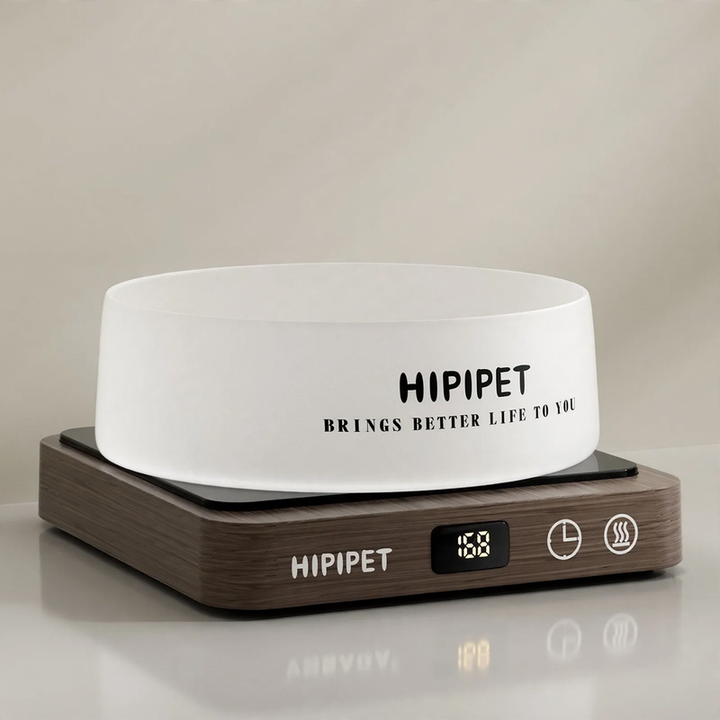 Heated drinking and feeding bowl for pets