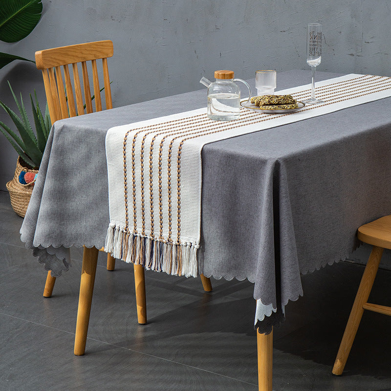 Decorative table runner in Scandinavian-minimalist design with macrame fringes Kalsten
