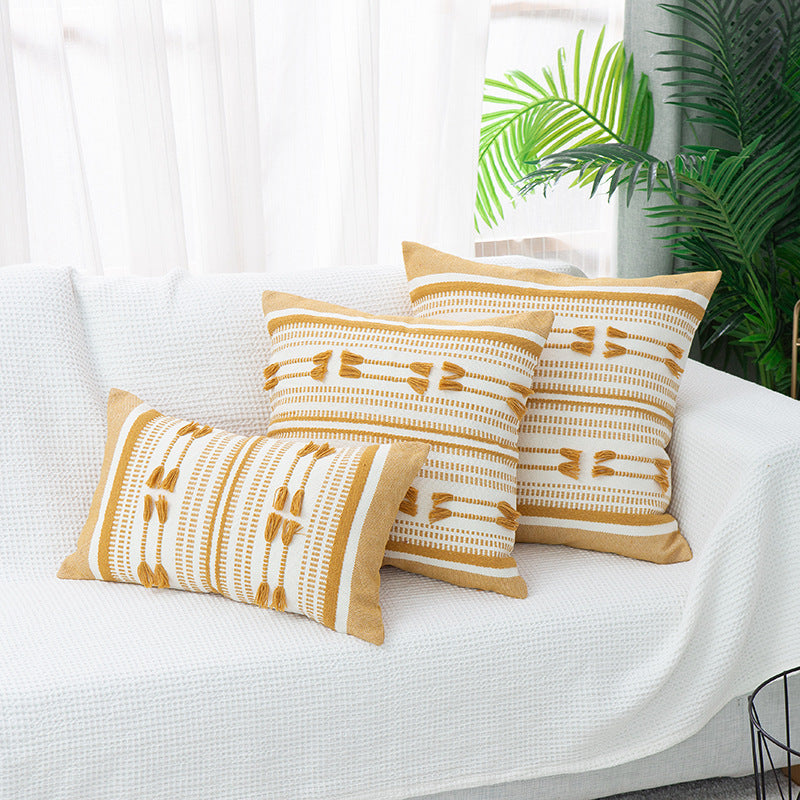 Woven decorative cushion cover with ordered tassel application and structured jacquard weaving Kalsten