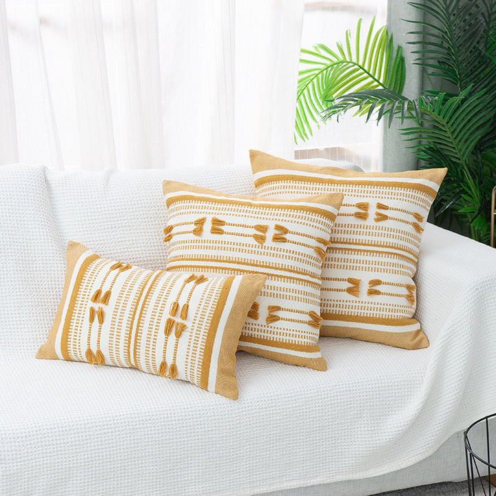 Woven decorative cushion cover with ordered tassel application and structured jacquard weaving Kalsten