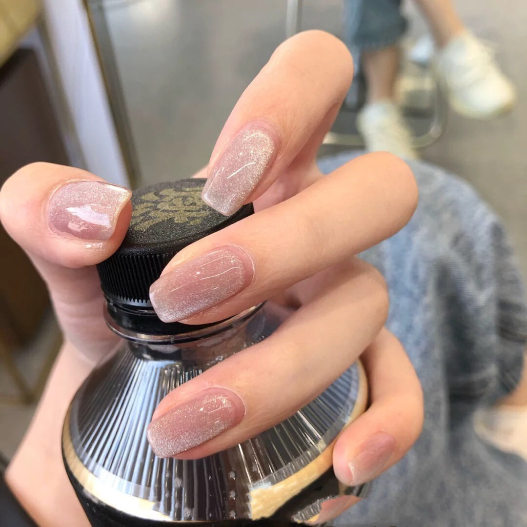 Artful nail art with a gentle glitter effect and elegant finish Kalsten