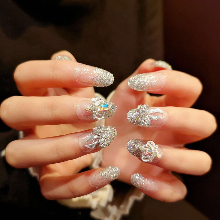 Nail art with sparkling rhinestone and glitter accents Kalsten