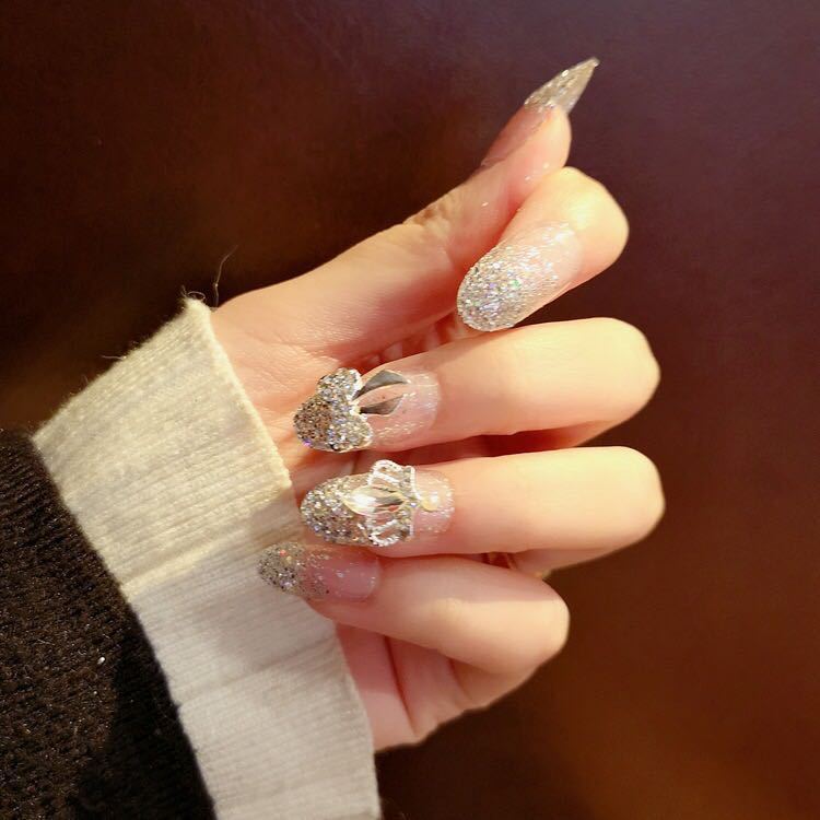Nail art with sparkling rhinestone and glitter accents Kalsten