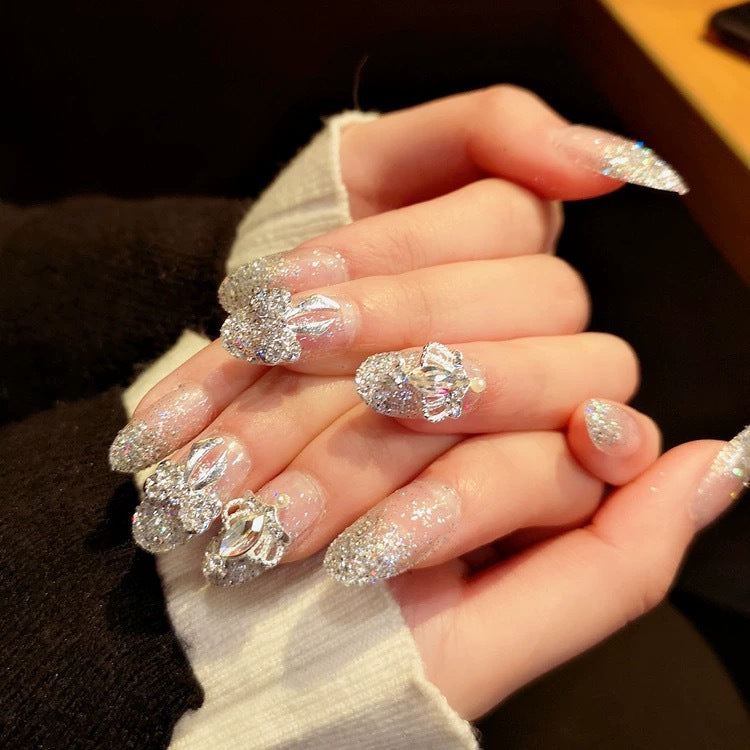 Nail art with sparkling rhinestone and glitter accents Kalsten