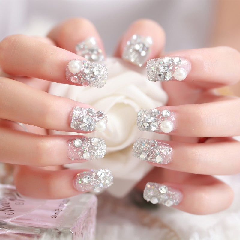 Art nails with glitter and pearl accents Kalsten