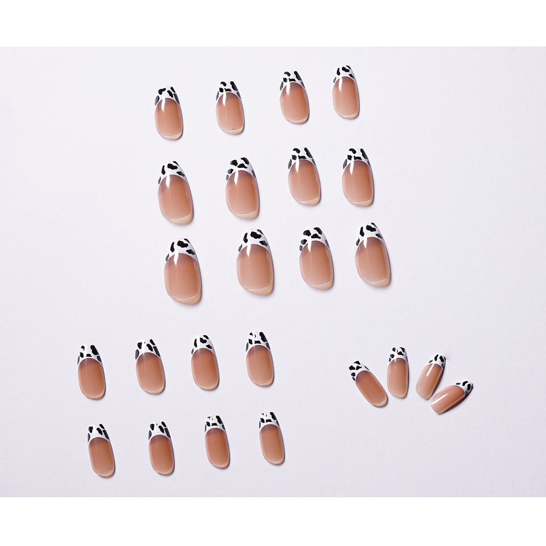 Stylish nail extensions in modern cow print style Kalsten