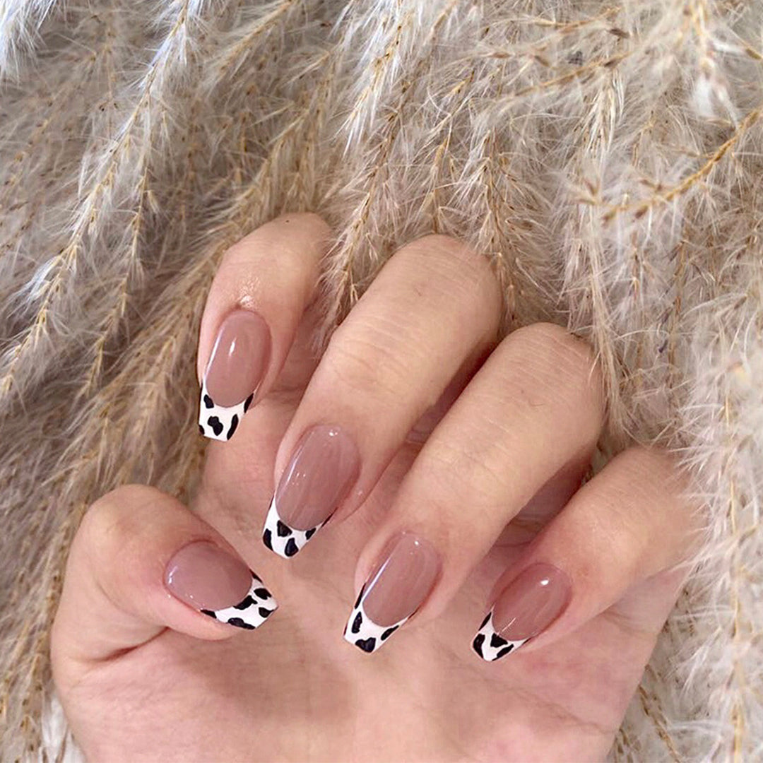 Stylish nail extensions in modern cow print style Kalsten