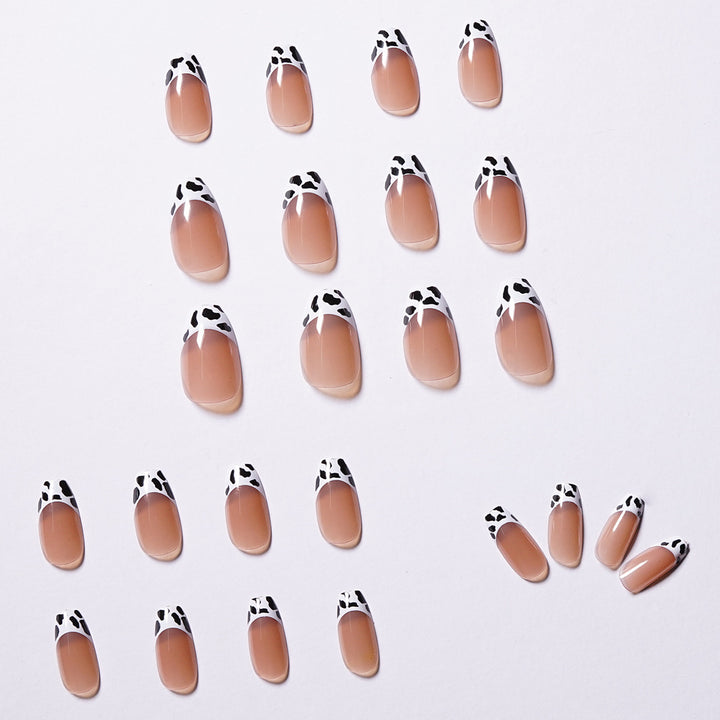 Stylish nail extensions in modern cow print style Kalsten