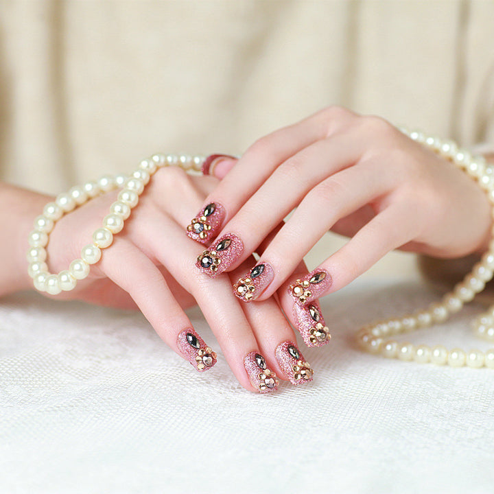 Glamorous artificial nails with glitter and jewelry decoration Kalsten