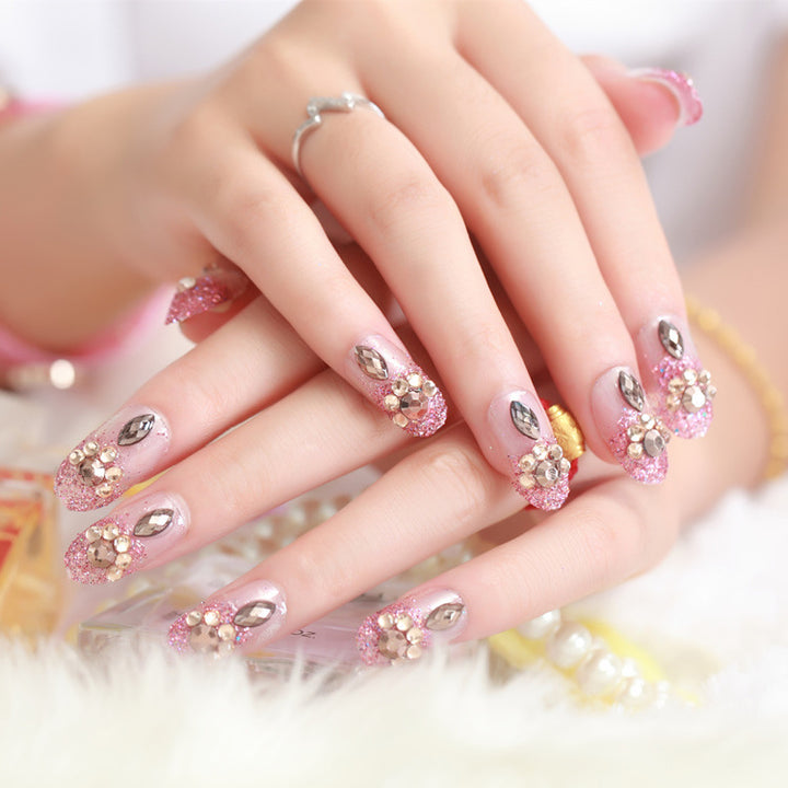 Glamorous artificial nails with glitter and floral elements Kalsten