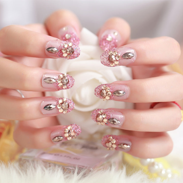 Glamorous artificial nails with glitter and floral elements Kalsten