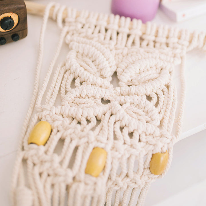 Macrame phone pouch with wooden beads, leaf relief and hanging loop Kalsten