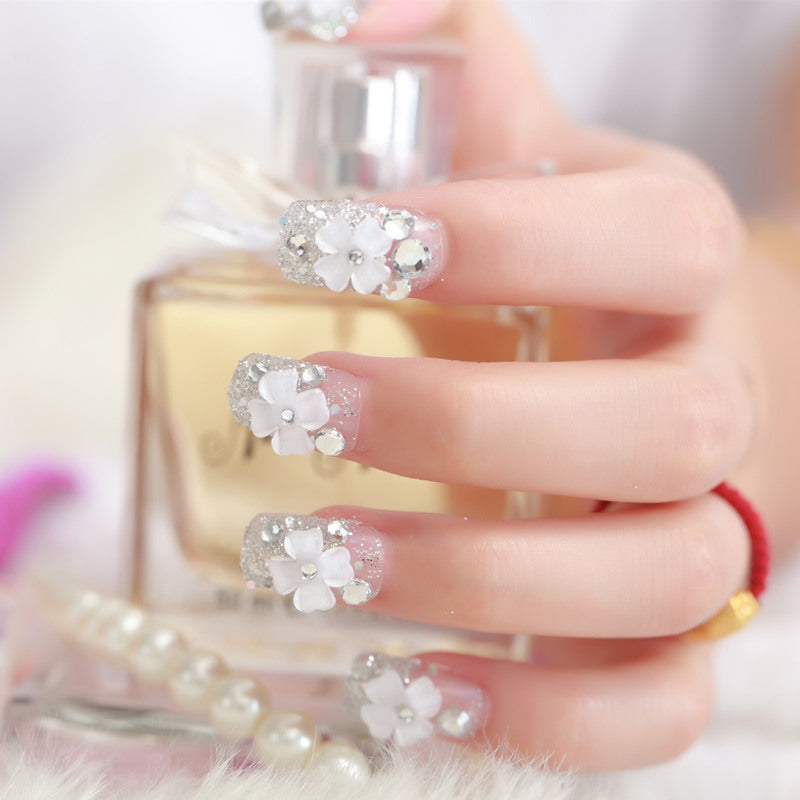 Artificial nails with glitter and floral 3D accents Kalsten