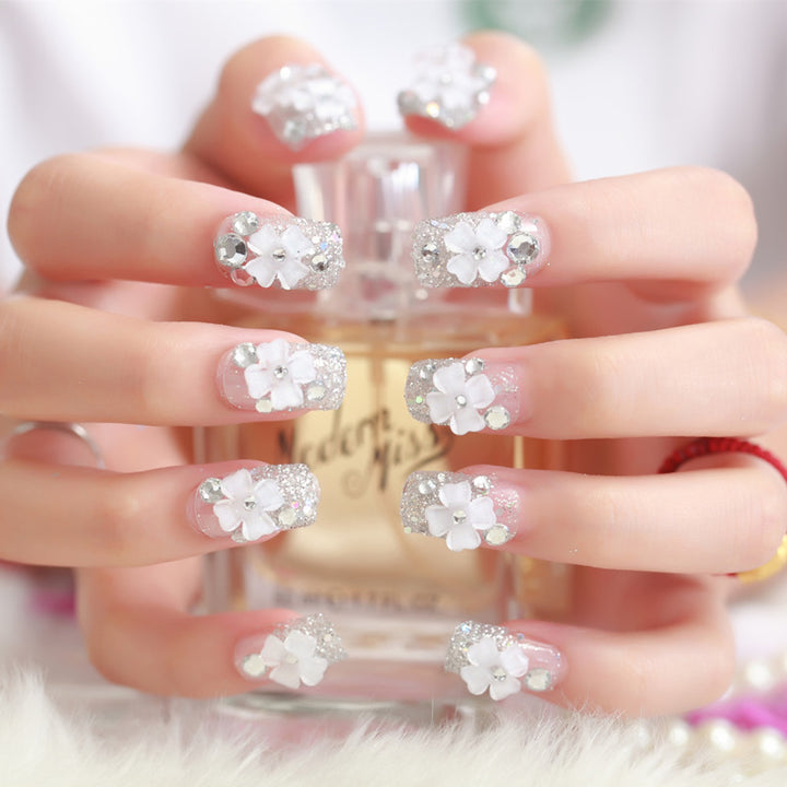 Artificial nails with glitter and floral 3D accents Kalsten