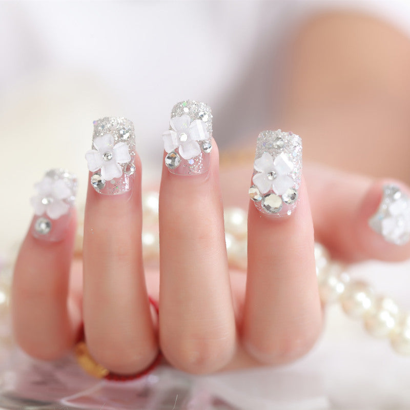 Artificial nails with glitter and floral 3D accents Kalsten