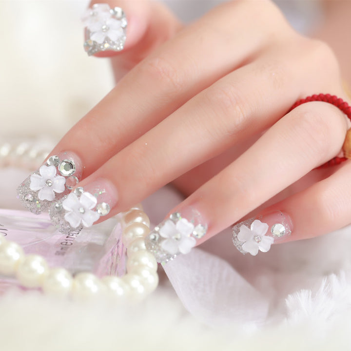 Artificial nails with glitter and floral 3D accents Kalsten