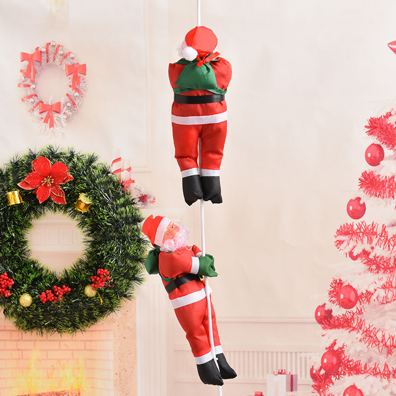 Decorative Santa Claus figures in climbing style