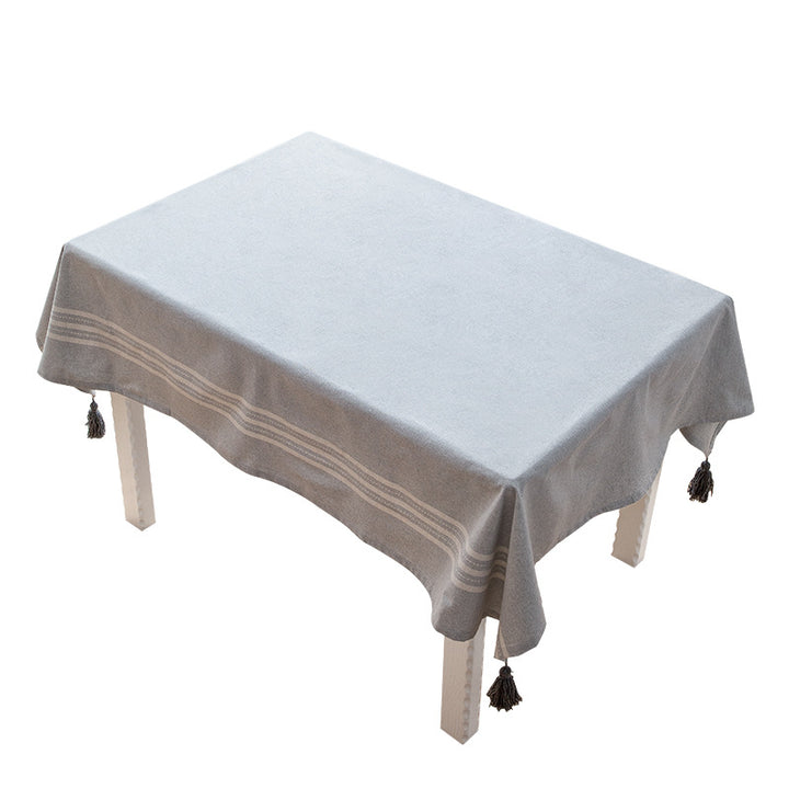 Rectangular linen look tablecloth with fringed tassels and side stripe border design Kalsten
