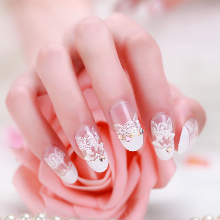Elegant artificial nails with tip pattern and pearl embellishment Kalsten