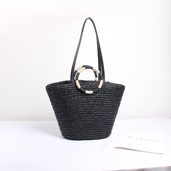 Designer shoulder bag with playful lettering and decorative tassel detail Kalsten