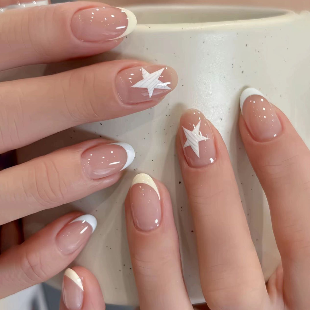 Elegant artificial nails with classic French tip and intricate star design Kalsten