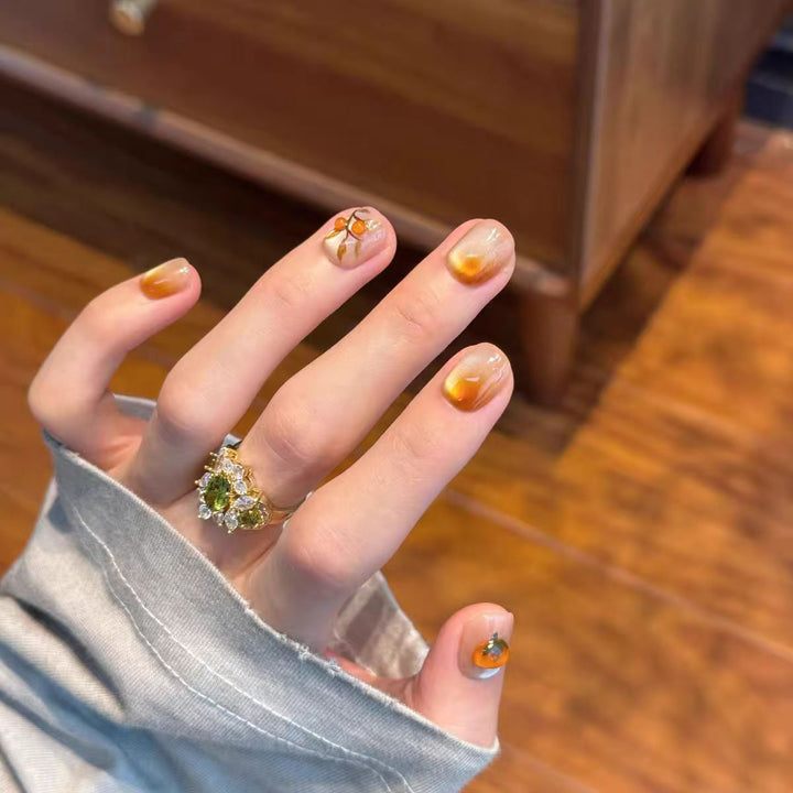 Artificial nails with elegant ombre effect and floral accents Kalsten