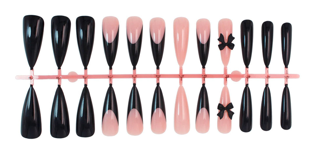 Acrylic nail set with elegant black-and-white design and playful accents Kalsten
