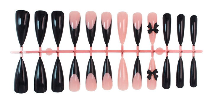 Acrylic nail set with elegant black-and-white design and playful accents Kalsten