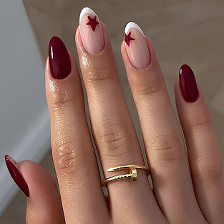 Glamorous stiletto nails with elegant star design Kalsten