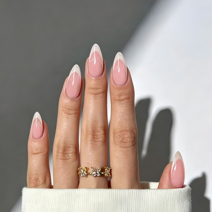 Artificial nails with elegant French design and curved accents Kalsten