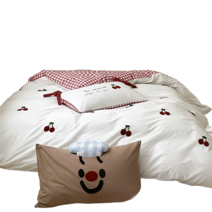 Children's bedding set with embroidered sprinkle appliqués, cuddle pillow and reversible function