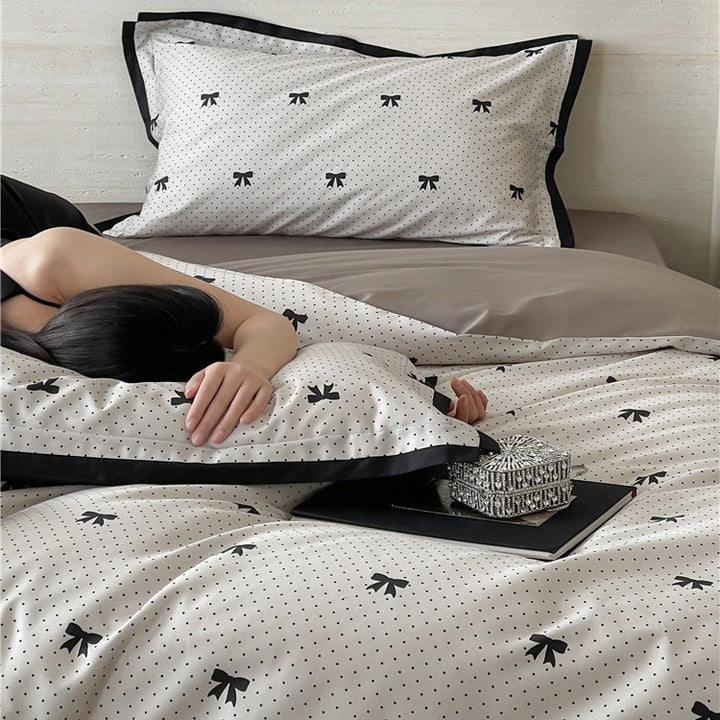 Luxurious cotton satin bedding set with butterfly motif and contrasting frame edge