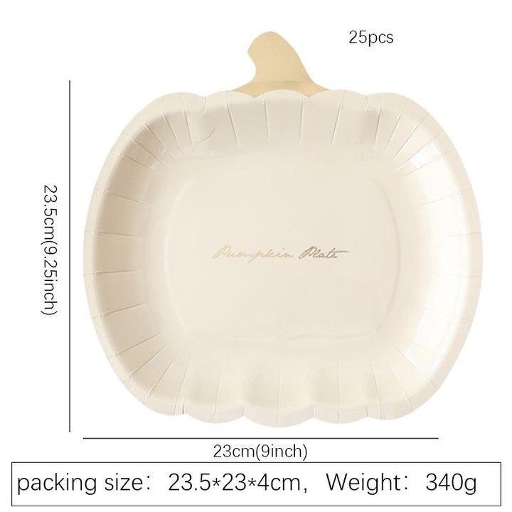 Disposable paper plates in pumpkin shape with spooky face design
