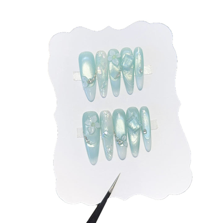 Artificial nails with floral designs and glitter effects Kalsten